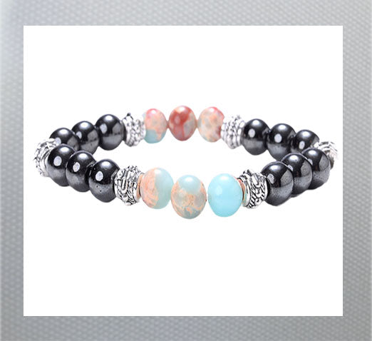 Volcanic Stone Hematite Bracelet and Tiger Eye Beads. Hematite is known for it grounding and calming properties, while tiger eye is believed to bring good luck and protection. Turquise and brown off white swirls and black shiney beads. Men and Women